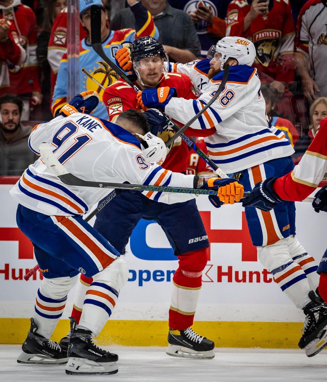 Florida’s Niko Mikkola gets mobbed by Edmonton players during a scuffle at the end of the first period of Game 3 in the NHL Stanley Cup Final series at Amerant Bank Arena on Monday, June 9, 2025, in Sunrise, Fla.