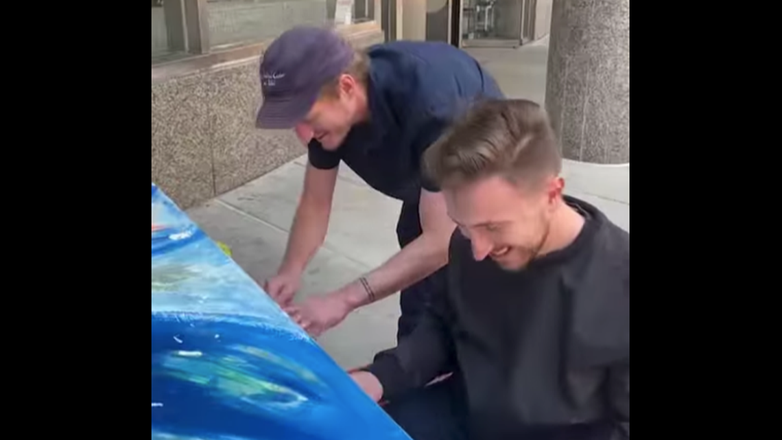 Jeremiah Fraites, left, surprised a piano player performing a song by The Lumineers, the folk rock band of which he is a founding member.