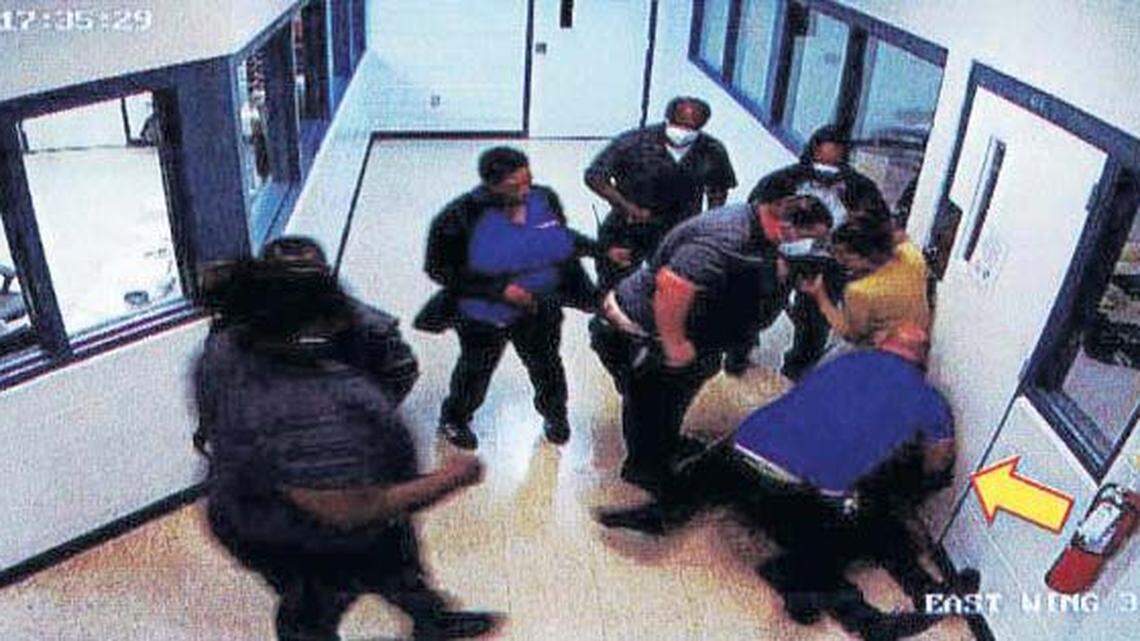 A youth is restrained at the Okeechobee Juvenile Offender Corrections Center.