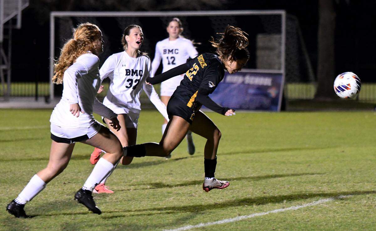 American Heritage junior forward Allison Aleman scores her second goal of the game against Orlando Bishop Moore during the Class 4A girls soccer state championship game on Friday at Lake Myrtle Sports Complex.