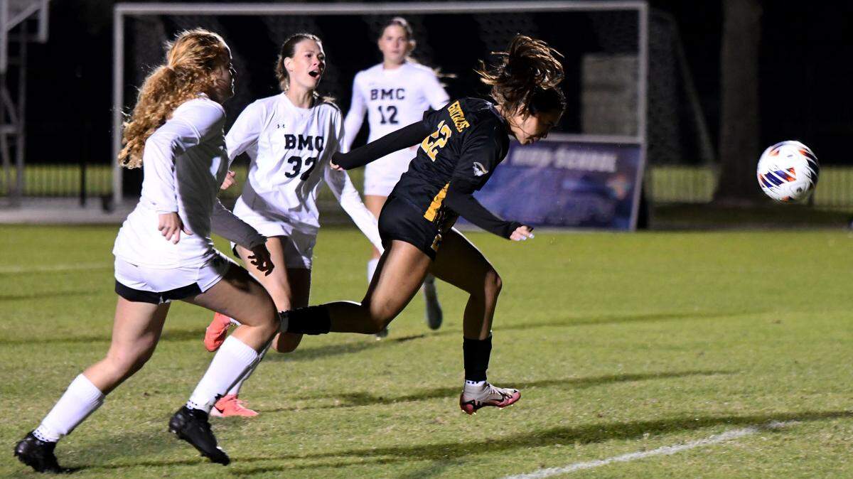 American Heritage junior forward Allison Aleman scores her second goal of the game against Orlando Bishop Moore during the Class 4A girls soccer state championship game on Friday at Lake Myrtle Sports Complex.
