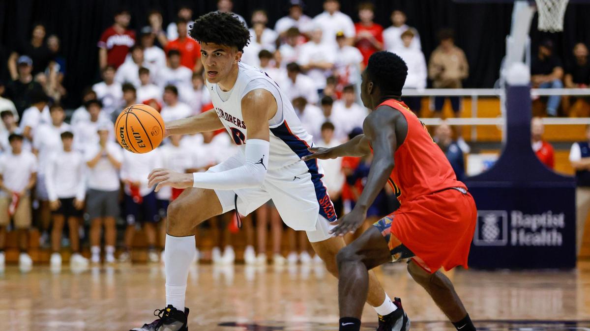 Columbus power forward Cameron Boozer (12) dribbles the basketball during the first half of the basketball regional final against Deerfield Beach at the Ocean Bank Arena at Florida International University in Miami, Florida, Friday, February 24, 2023.