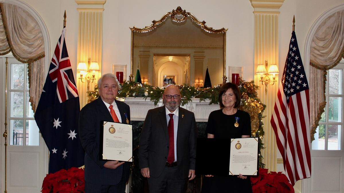 Australian Ambassador to the United States Arthur Sinodinos AO honored Miami arts leaders Dennis and Debra Scholl as Members of the Order of Austrailia for their efforts to collect, donate and promote contemporary aboriginal artwork.