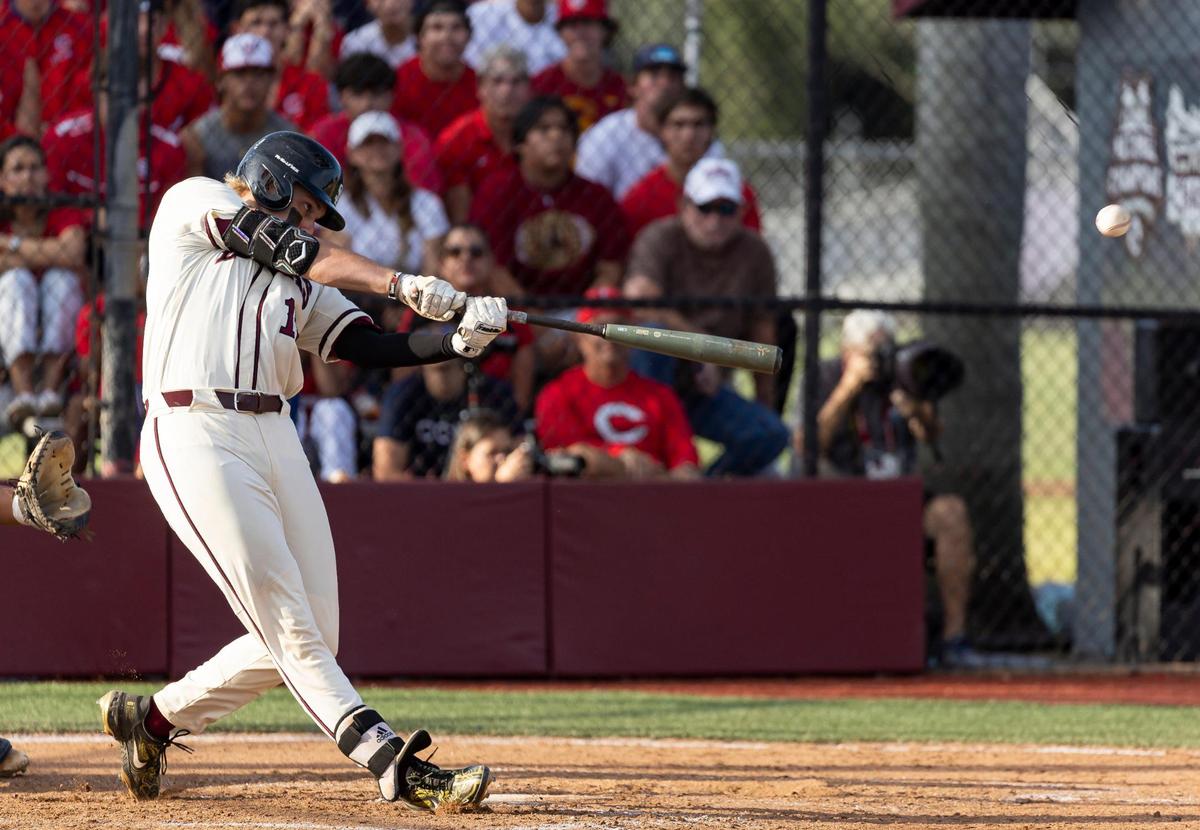 Marjory Stoneman Douglas’ Matthew Ossenfort (17) hits a home run against Christopher Columbus in the second inning of their Region 4-7A baseball game final at Anthony Rizzo Field on Tuesday, May 16, 2023, in Parkland, Fla.