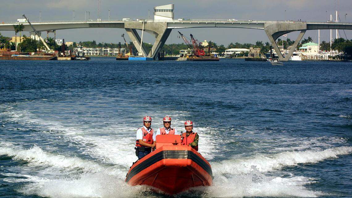 File photo of Sen. Bob Graham, right, joining U.S. Coast Guard officer Michael Tanner, at helm, and Seaman Jonathan Becker as they patrolled the waters of Port Everglades.