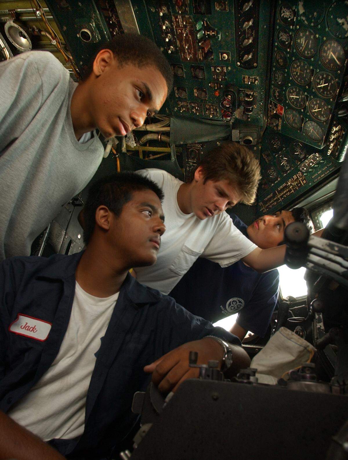 In this June 9, 2005 file photo, four student cadets from the Civil Air Patrol Squadron at Miramar High School check out the cockpit of an Eastern DC-7B, that is being renovated at Opa-Locka Airport by Legendary Airlines. The boys from the left are: Jahmar Resilard, 15, 10th grade, Rajendra Roopnarine, 15, 11th grade, Nick Aslanir, 16, 11th grade, and Miguel Linares, 17, 11th grade.