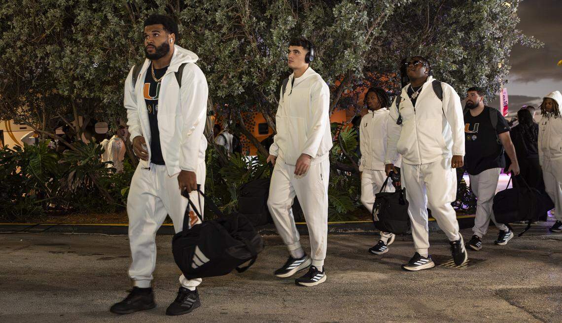 Miami Hurricanes defensive lineman Akheem Mesidor (3) and offensive lineman Matthew McCoy (78) arrive to the Fontainebleau Miami Beach ahead of their College Football Playoff National Championship Game against the Indiana Hoosiers on Friday, Jan. 16, 2026, in Miami Beach, Fla.