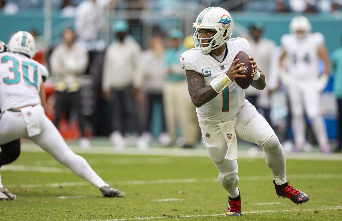Miami Dolphins quarterback Tua Tagovailoa (1) looks to pass the ball in the second half of his NFL game against the New Orleans Saints at Hard Rock Stadium on Sunday, Nov. 30, 2025, in Miami Gardens, Fla.