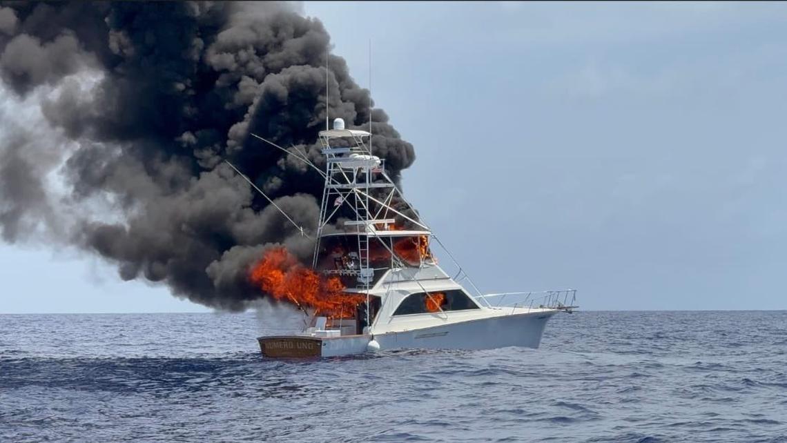 Flames shoot out of a 48-foot fishing yacht off the coast of Jupiter Monday, May 26, 2025. The Coast Guard said three people were rescued by other boaters in the area. No one was injured, according to the Coast Guard.