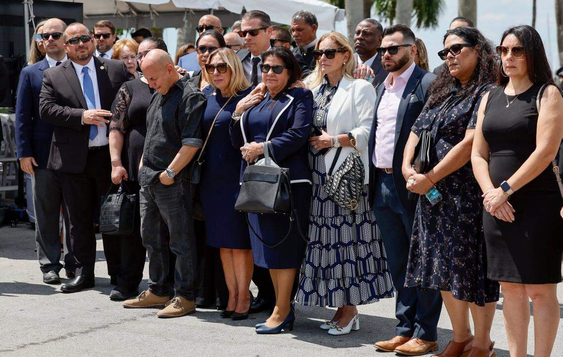 Family and friends gather during a memorial service for Commissioner Manolo Reyes as City of Miami Police and Fire Honor Guard members move the coffin to a waiting hearse at Miami City Hall in Miami, Florida on Wednesday, April 16, 2025.