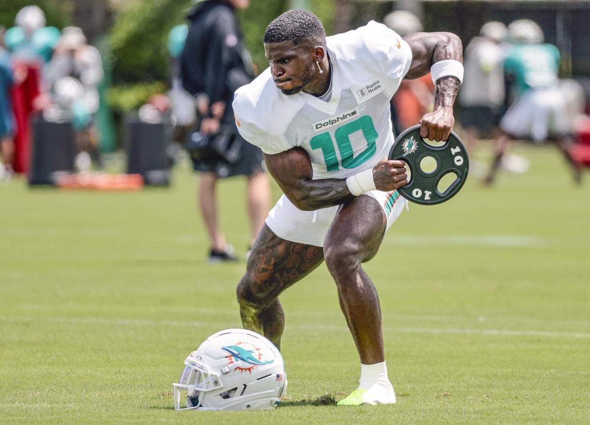 Miami Dolphins wide receiver Tyreek Hill (10) works out during practice at Miami Dolphins Training Camp in Miami Gardens, Florida, on Wednesday, September 3, 2025.