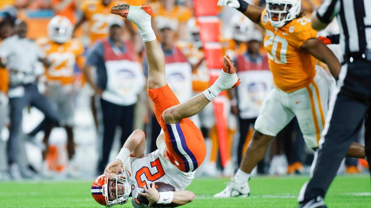 Clemson Tigers quarterback Cade Klubnik (2) is upended on a sack in the first half by Tennessee Volunteers linebacker Aaron Beasley (24) at Hard Rock Stadium in Miami Gardens, Florida on Friday, December 30, 2022.