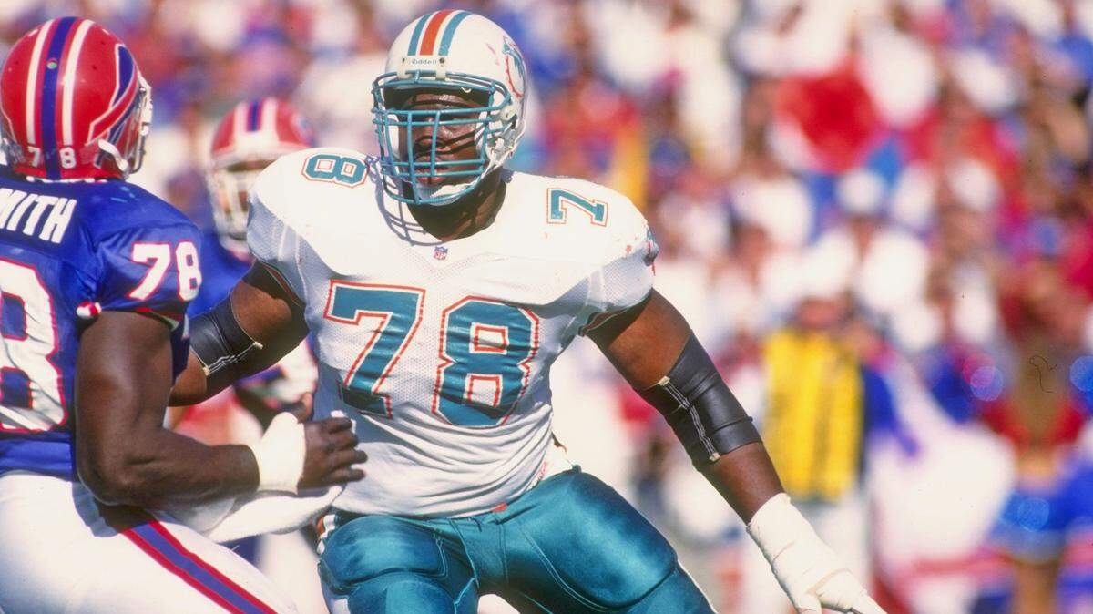 Offensive lineman Richmond Webb of the Miami Dolphins prepares to block a Buffalo Bills player during a game at Rich Stadium in Orchard Park, New York on October 4, 1992. Webb is among the 102 nominees for the Pro Football Hall of Fame.