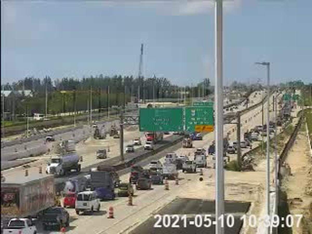 Southbound Florida Turnpike traffic exits at Northwest 12th Street.