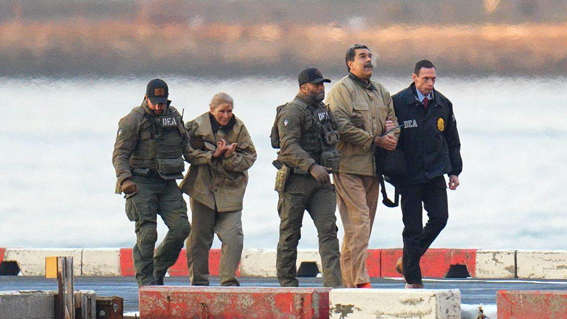 NEW YORK, NY - JANUARY 5: Nicolas Maduro and his wife, Cilia Flores, are seen in handcuffs after landing at a Manhattan helipad, escorted by heavily armed Federal agents as they make their way into an armored car en route to a Federal courthouse in Manhattan on January 5, 2026 in New York City. (Photo by XNY/Star Max/GC Images)