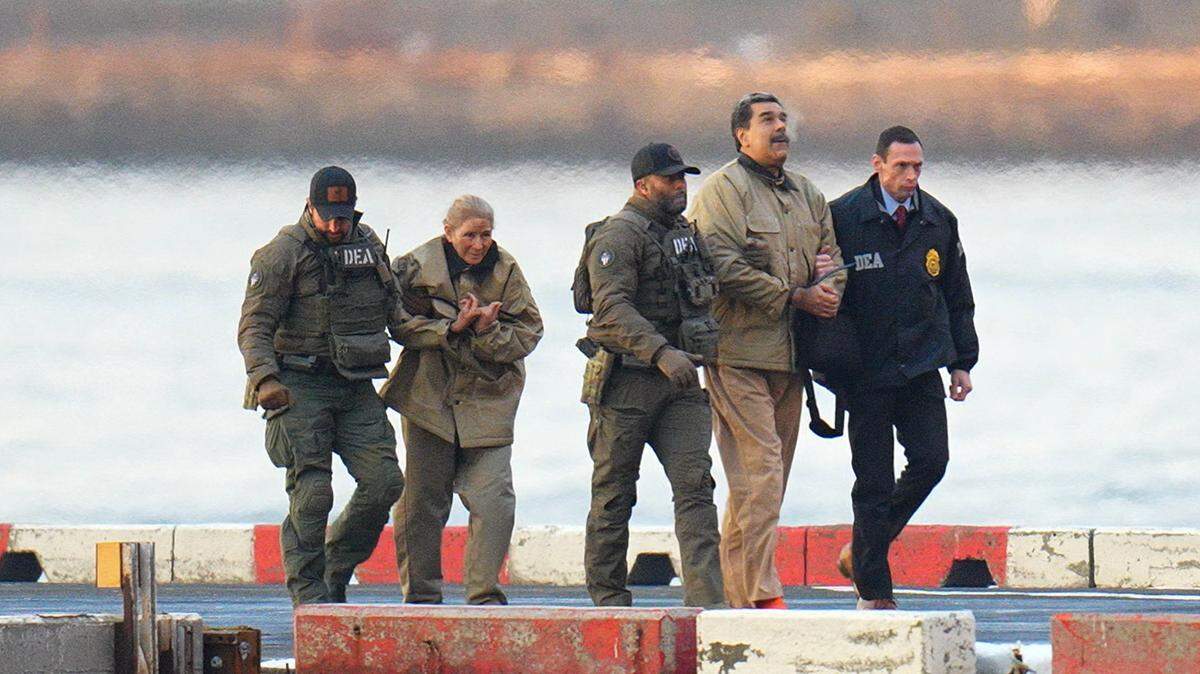 Nicolas Maduro and his wife, Cilia Flores, are seen in handcuffs on Jan. 5, 2026, in New York City. 