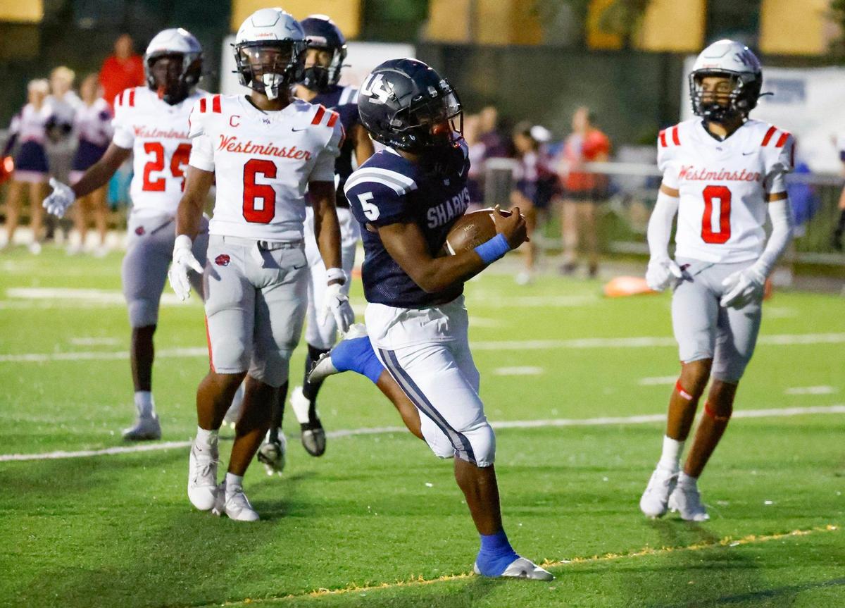 University School Jacques Dixon Jr. (5) scores in the first half of the game against Westminster at AutoNation Field at the University School campus in Davie, Fl. on Thursday, November 2, 2023.