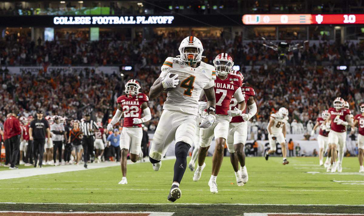 Miami Hurricanes running back Mark Fletcher Jr. (4) scores against the Indiana Hoosiers in the second half of their College Football Playoff National Championship Game at Hard Rock Stadium on Monday, Jan. 19, 2026, in Miami Gardens, Fla.