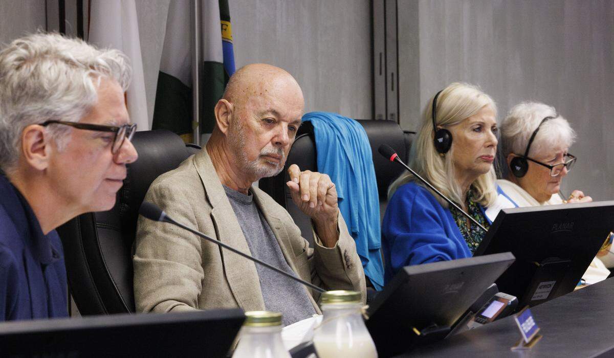 From left to right: Board members Fred Villiers-Furze, Terry Cantrell, Diana Pittarelli, and Kathleen DiBonna listen to a presentation from the applicant during a Historic Preservation Board meeting on Tuesday, Dec. 9, 2025, at Hollywood City Hall in Hollywood, Fla. The board must decide whether to approve a mikvah, a Jewish bathhouse, on a residential street situated between single family homes.