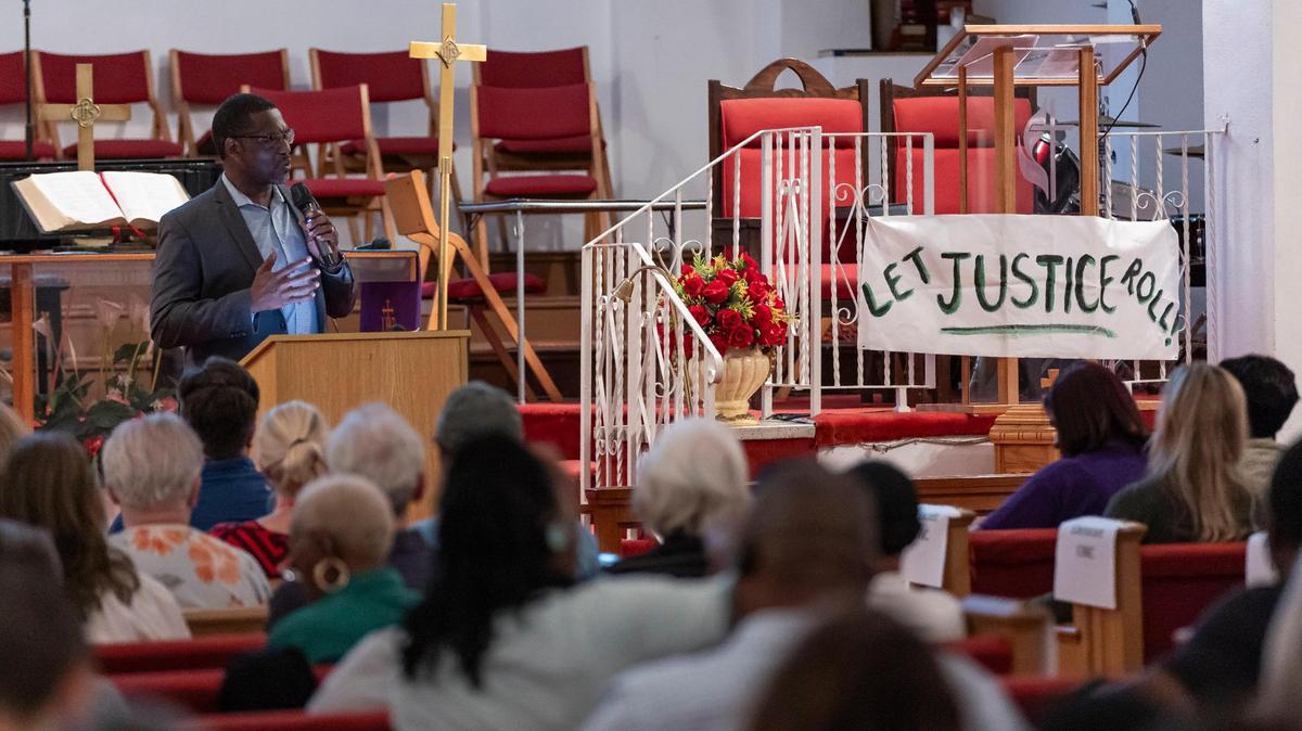 Reverend Robert Brooks speaks to members of an interfaith group called People Acting for Community Together, or PACT, during their annual assembly meeting at the Ebenezer United Methodist Church on Monday, Oct. 30, 2023. PACT is made up of 40 congregations from across South Florida.