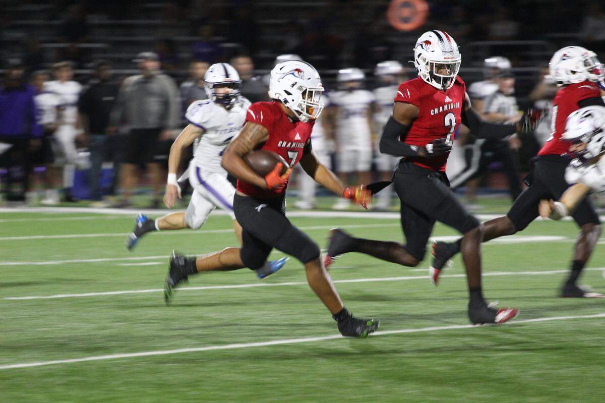 Chaminade-Madonna running back Davion Gause breaks open for a big run during the Lions’ 56-0 victory over True North on Friday night in a Class 1M state semifinal.
