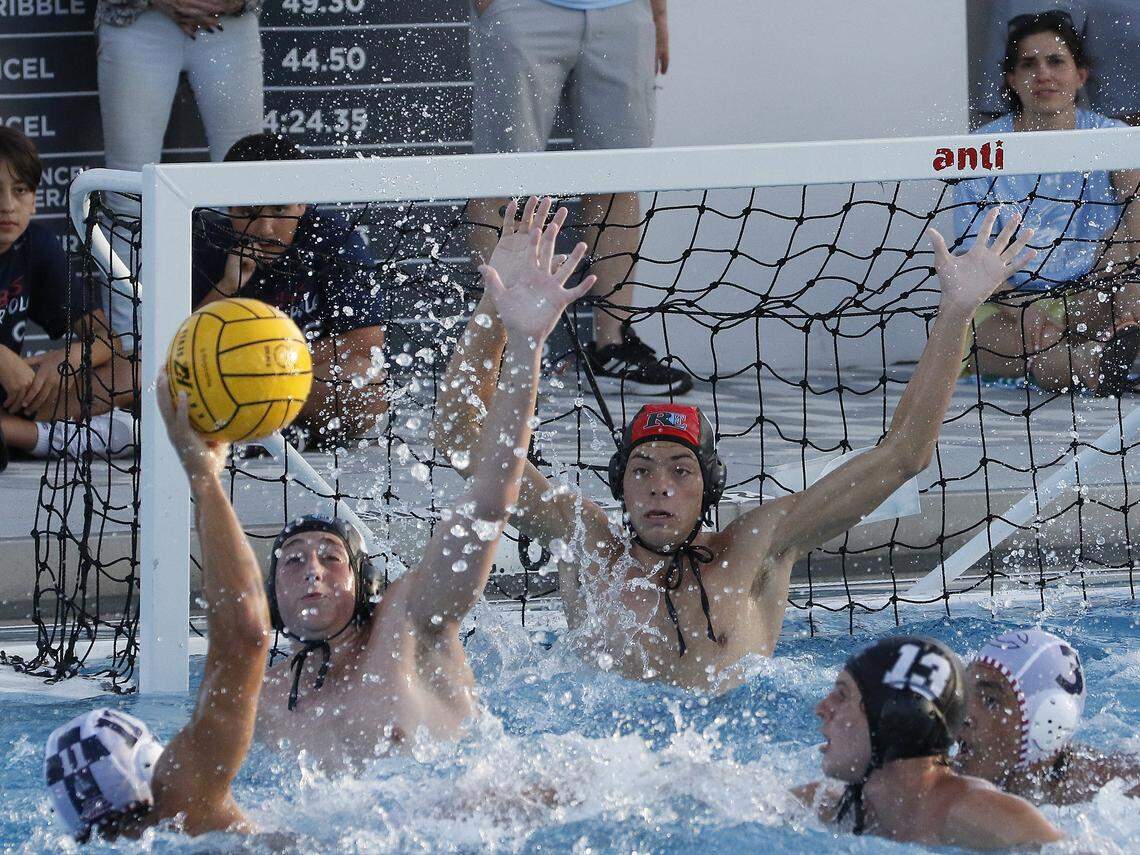 Columbus Explorers Sergio Samada (11) attempts to score against Ransom Everglade Riders during regional boys' water polo final game on Thursday, April 16, 2026 at Gulliver Prep HS in Miami. Andrew Uloza / for Miami Herald