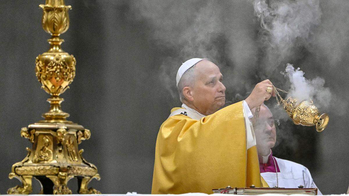 Pope Leo XIV holds an incent burner as he performs the Christmas Eve mass at St Peter's Basilica in the Vatican on Dec. 24, 2025.