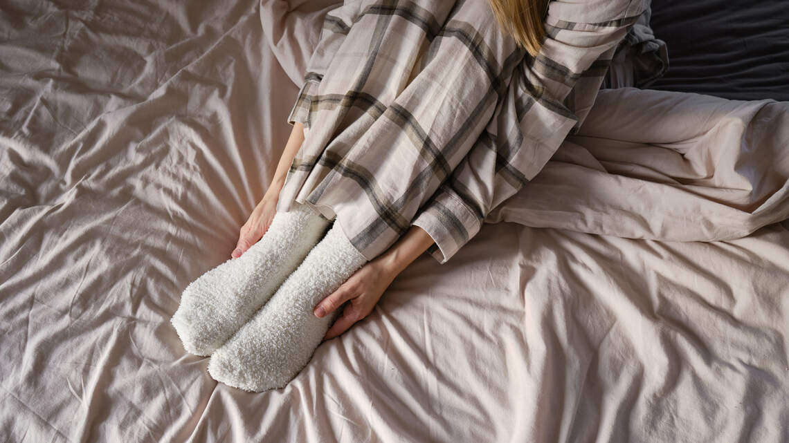 Why Sleep Doctors Say Wearing Socks to Bed Might Actually Help You Fall Asleep Faster