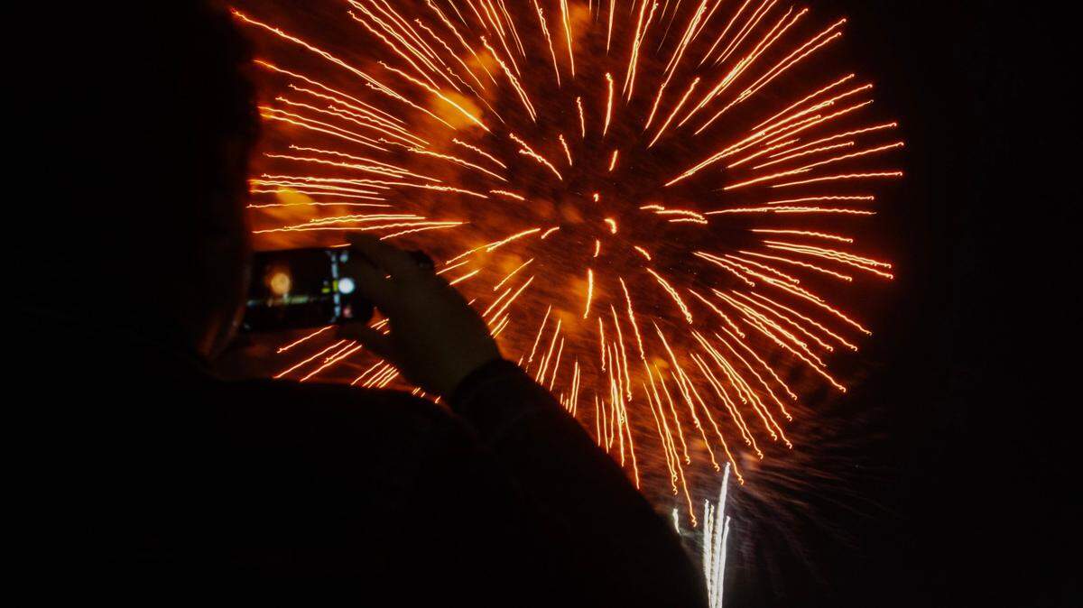 Attendees watch the fireworks during the Fourth of July Bayfront Park Celebration at Bayfront Park on Tuesday, July 4, 2023 in Miami, Fla.