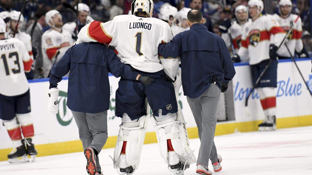 Florida Panthers goaltender Roberto Luongo (1) is helped to the bench after being injured during the second period of an NHL hockey game against the Tampa Bay Lightning Saturday, Oct. 6, 2018, in Tampa.