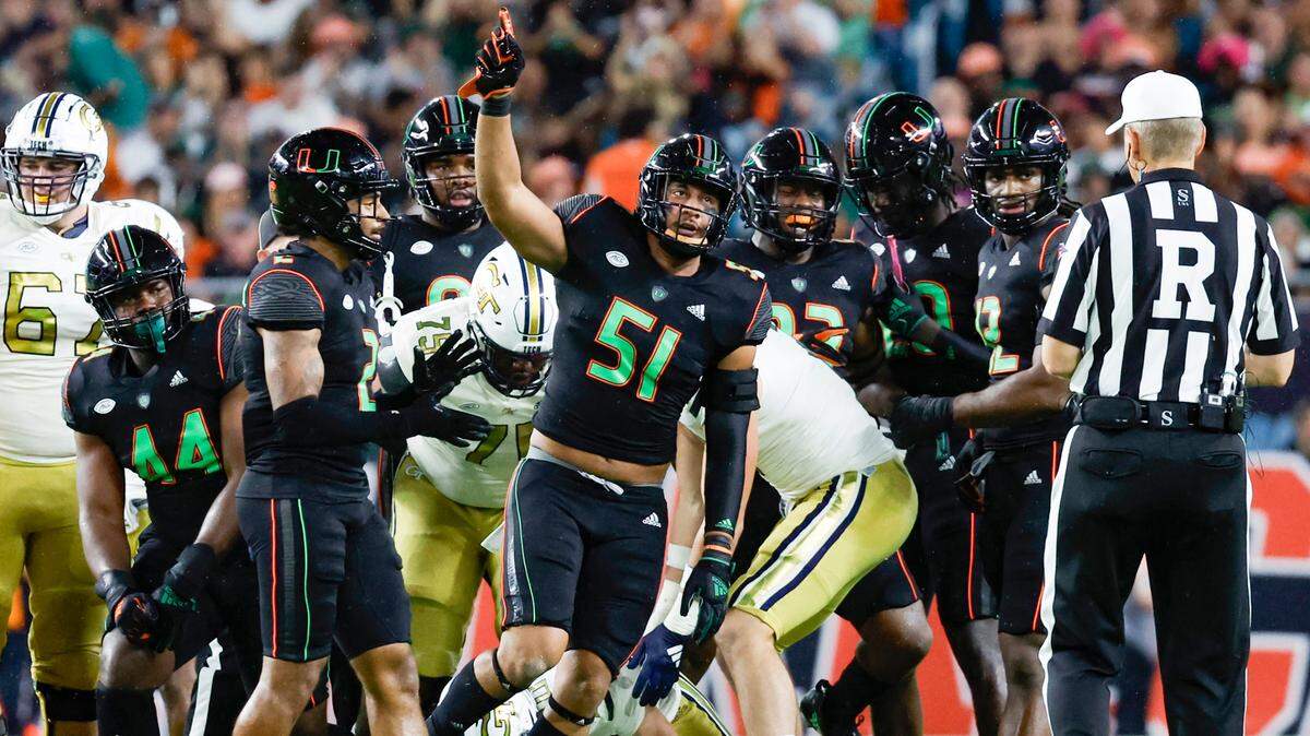 Miami Hurricanes linebacker Francisco Mauigoa (51) reacts after sacking Georgia Tech Yellow Jackets quarterback Haynes King (10) in the first quarter at Hard Rock Stadium in Miami Gardens on Saturday, October 7, 2023.