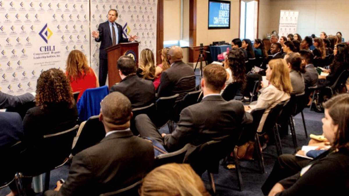 Participants listen to a presentation at a forum sponsored by the Congressional Hispanic Leadership Institute.