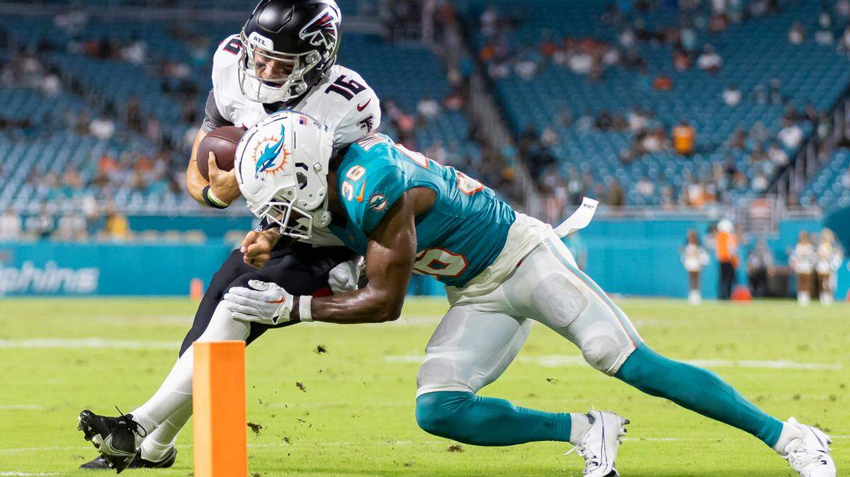 Miami Dolphins cornerback Storm Duck (36) stops Atlanta Falcons quarterback Nathan Rourke (16) short of the goal line in the fourth quarter of their NFL pre-season football game at Hard Rock Stadium on Friday, Aug. 9, 2024, in Miami Gardens, Fla.A Dol