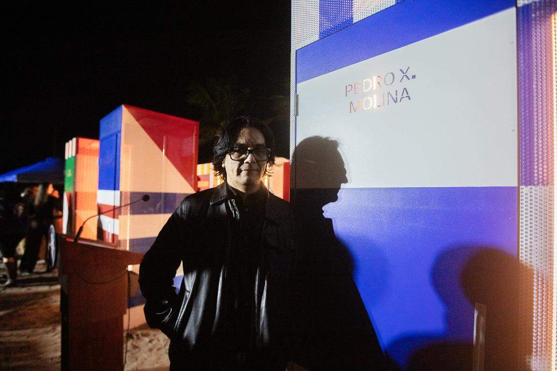Miami Beach, Florida, December 1, 2025 - Artist PedroX. Molina stands next to one of his works during the unveiling of an installation titled Doors to Freedom. Doors to Freedom is public art installation that tells the stories of artists exposing authoritarian regimes. The installation will run from Dec. 1-7, 2025, at Art Week Miami Beach, during this year's Art Basel. Every artist featured in Doors to Freedom has been harassed, jailed, or exiled for refusing to remain silent. They are, The Gao Brothers (China), Luis Manuel Otero Alcántara (Cuba), Rayma Suprani (Venezuela), Song Byeok (Korea), Azza Abo Rebieh (Syria), Pedro X. Molina (Nicaragua), Zehra Dogan (Turkey) The installation was produced by the Human Rights Foundation (HRF), Cuban Freedom March (CFM), and sponsored by the City of Miami Beach