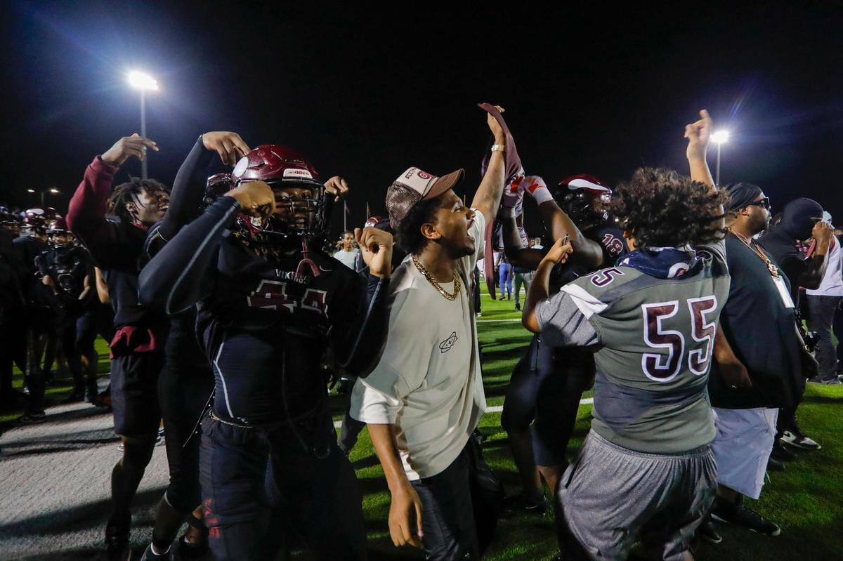 Norland Vikings football players celebrate an overtime win over the Central Rockets during a high school football game at Traz Powell Stadium in Miami Florida, Friday, October 13, 2023.