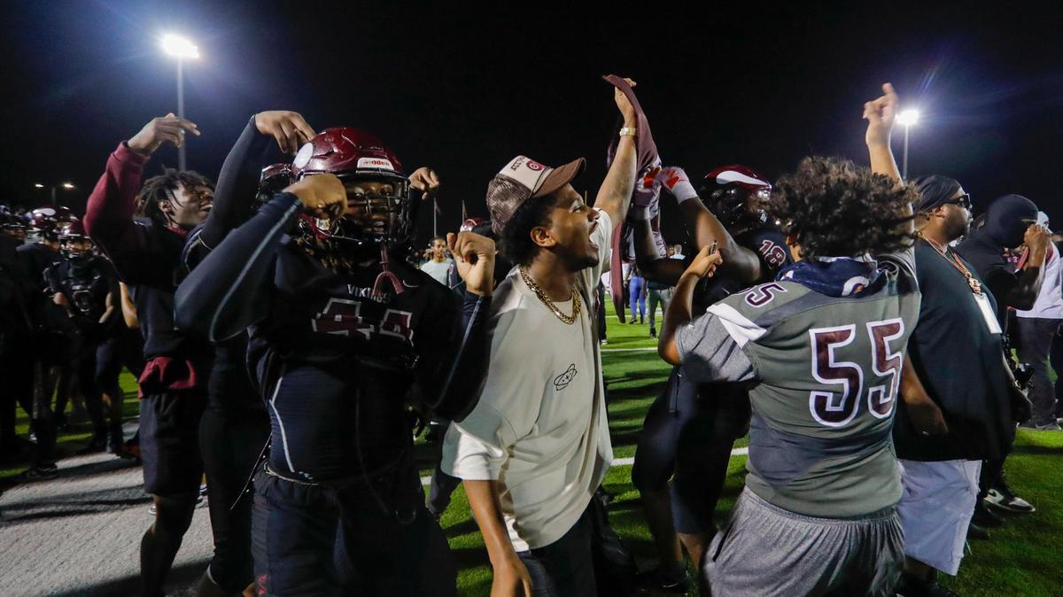 Norland Vikings football players celebrate an overtime win over the Central Rockets during a high school football game at Traz Powell Stadium in Miami Florida, Friday, October 13, 2023.