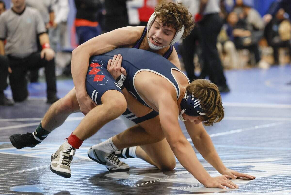 South West High School wrestler Didier Novoa, at top, battles Columbus High's Tommy Campian during the GMAC Boys Wrestling Championships at South Dade Senior High School in Homestead, Florida on Friday, February 6, 2026.