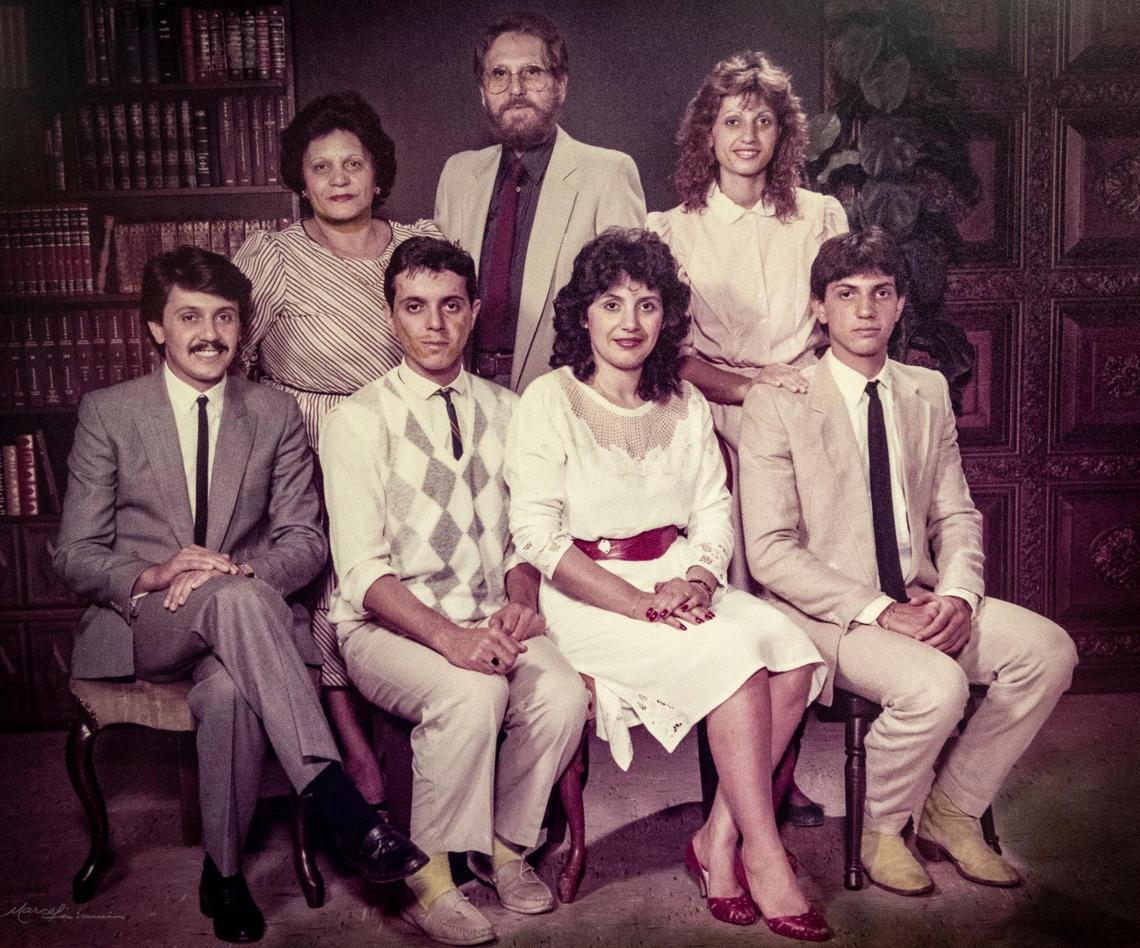 Miami, March 16, 2022 - A family photo in the dining room of Nunzio’s restaurant. Current owner, Roberto Auricchio, is seated second from left. The original owners, immigrants from Italy, have passed away and all of their children who helped run it are retiring.