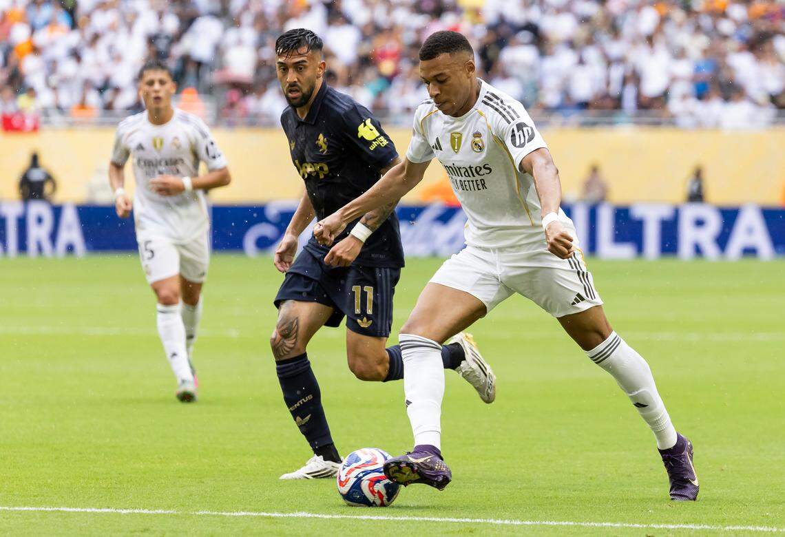 Real Madrid CF forward Kylian Mbappe (9) runs with the ball as Juventus forward Nicolas Gonazalez (11) defends in the second half of their round of 16 FIFA Club World Cup soccer match at Hard Rock Stadium on Tuesday, July 1, 2025, in Miami Gardens, Fla.
