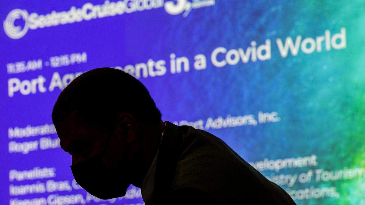 People arrive to the Seatrade Cruise Global 2021 conference at the Miami Beach Convention Center on Monday, Sept. 27, 2021.