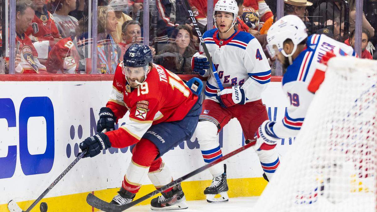 Florida Panthers left wing Matthew Tkachuk (19) competes for the puck against New York Rangers defenseman K’Andre Miller (79) in the third period of Game 4 during the Eastern Conference finals of the NHL hockey Stanley Cup playoffs at the Amerant Bank Arena on Tuesday, May 28, 2024, in Sunrise, Fla.