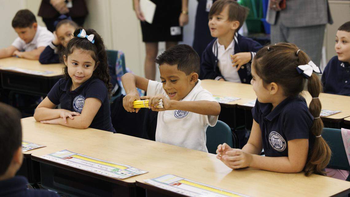Kindergarten students in the classical education classroom of Ms. Geraldine Cameron participate in a lesson during the school day on Tuesday, Nov. 18, 2025, at Village Green Elementary School in Miami, Fla. Cameron has helped to implement a classical education system at the school that originates from Ancient Greece meant to cultivate critical thinking and virtues in its students, and it disconnects them from technology to focus on active listening.