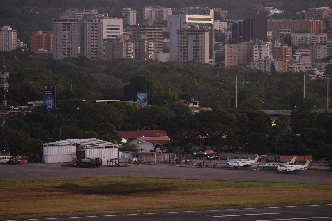 A scorched patch of grass is seen at La Carlota airport after explosions and low-flying aircraft were heard on January 3, 2026 in Caracas, Venezuela.