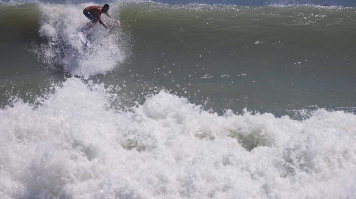 Erin brought waves estimated at 8 to 12 feet near Stuart, bringing surfers out in force on Thursday.