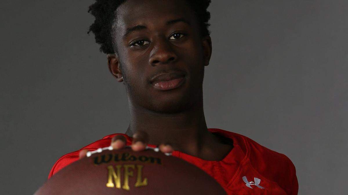 Running back Donovan Jones, who had 116 yards and two touchdowns, led the Champagnat Lions to the high school football win. 