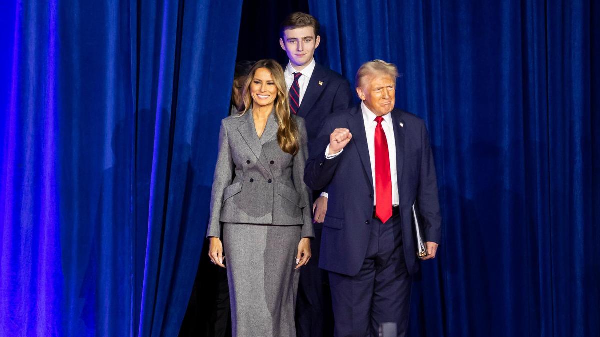 Republican presidential nominee former President Donald Trump arrives to his election night party alongside his wife, Melania Trump, and his son, Barron Trump, at the Palm Beach County Convention Center on Tuesday, Nov. 5, 2024, in West Palm Beach, Fla.