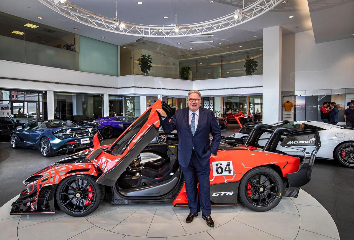 Ken Gorin, President & CEO at The Collection in Coral Gables, poses with a McLaren Senna “hypercar” priced at $1.7 million.