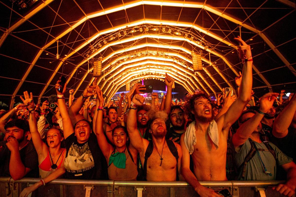 Festival goers react to a performance on the Monster stage during the second day of Rolling Loud Miami, an international hip-hop festival, at Hard Rock Stadium in Miami Gardens, Florida, on Saturday, July 23, 2022.