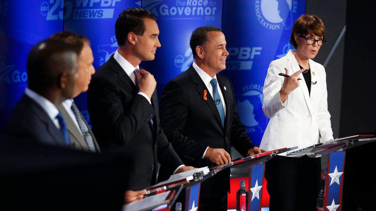 Democratic gubernatorial candidates, from right, Gwen Graham, Philip Levine, Chris King, Jeff Greene and Andrew Gillum await the start of a debate ahead of the Democratic primary for governor on Thursday, Aug. 2, 2018, in Palm Beach Gardens, Fla.