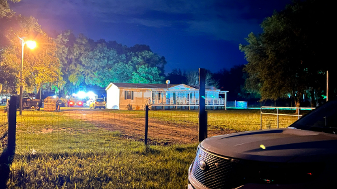 The deputy observed the suspect shooting into the door of the home in an attempt to reach family members taking refuge inside, officials said.